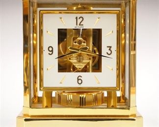 A late 20th century Le Coultre Atmos mantle clock.  15 jewel caliber 528-8 perpetual movement with square White enameled dial and Arabic numerals.  Brass case with glass panels.  Minor wear, running when cataloged.  9 1/4" high.  ESTIMATE $400-600