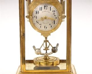 A turn of the century French Crystal regulator clock.  400 day time only movement with torsion pendulum, Silvered dial with Arabic numerals retailed by "Demaron, Sancoins", serial #25108.  Brass four glass case with molded top and base, simple bracket feet.  Some case wear, running when cataloged.  10 3/4" high.  ESTIMATE $400-600
