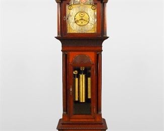 A turn of the century Walter H. Durfee Pattern 18 grandfather clock.  8-day weight driven three train movement with quarter hour striking on nine tubular chimes, arched Brass dial with painted moon phases and engraved hemispheres, a Silvered chapter ring with Arabic numerals and subsidiary dials for seconds, Chime/Silent and Westminster Chimes/Chime on Eight Bells, dial with engraved retailers name "James E. Caldwell & Co. Philadelphia", movement marked "Walter E. Durfee" on top edge of backplate, damascened plates.  Mahogany Chippendale style case with hand carved decoration features a molded broken arch top, turned finials with carved detail over an arched molded crown and conforming dial door with beveled glass flanked by turned columns with Brass capitols, over a carved molded frieze and waist door with carved Fan and beveled glass flanked by turned columns on a paneled base with carved moldings, turned columns with Brass capitols all supported by carved paw feet.  Original finish 
