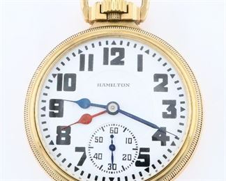 A Hamilton 950E Elinvar Model Dual Time Zone Railroad watch.  16 size, 23 j, Adj Temp & 5 pos, DR, DMK, GJS, SW, LS, Hamilton "Railroad Model" GF, OF, Porcelain DSD with Arabic numerals and dual hour hands marked "Hamilton", serial #264058.  Minor wear, winds, sets and running when cataloged.  ESTIMATE $800-1,200