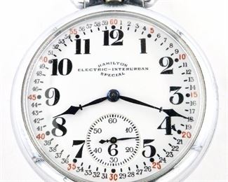 A Hamilton 974 Model "Special Electric-Interurban" pocket watch.  16 size, 17 j, Adj Temp & 3 pos, DR, DMK, SW, PS, Nickle OF, "Montgomery" Porcelain SSD with Arabic numerals marked "Hamilton, Electric-Interurban, Special", serial #2535862.  Minor wear, winds, sets and running when cataloged.  ESTIMATE $200-300