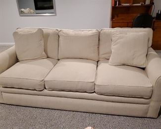 Light tan 3 cushion sofa