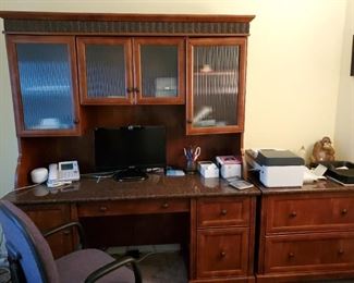 Desk with glass front hutch