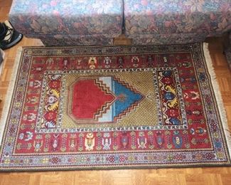 Hand made 3x5 rug in AMAZING condition. Colors are vibrant and ZERO stains or tears.