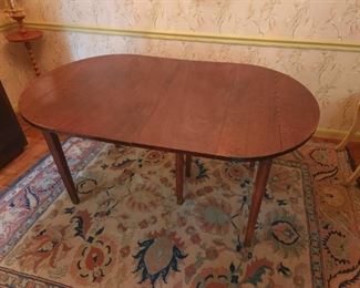 This table comes with 2 additional leafs(4 Total) and drop leaf sides. It folds down to approx 15" wide!