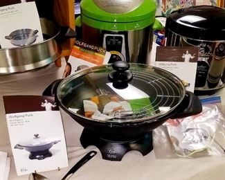 Much NIB cookware and household items. Wolfgang Puck