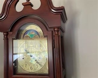 Grandfather clock with Mount Vernon logo.