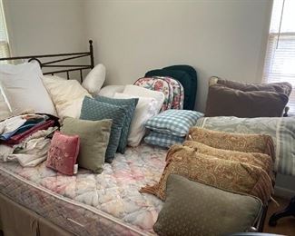 Pillows and queen size bed.