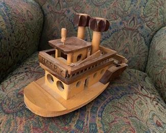 Wooden steamboat toy.