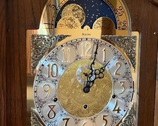 Lovely Grandfather Clock by Bulova. In working condition and measuring 23" x 11" x 80"

