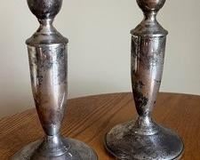 Pair of Sterling Weighted Candle Holders with wear consistent with age and use. Measuring 7" h 