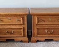 Pair of Wooden Nightstands. There are some light scratches and one drawer pull is damaged. Each measures 28” x 16” and 23.5” high. 