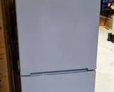 Insignia Refrigerator. A small fridge that’s perfect for a garage or basement. Measures 24” x 26” and 60” high