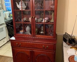 1940's Pennsylvania House solid cherry china cabinet and hutch with convex glass in two pieces