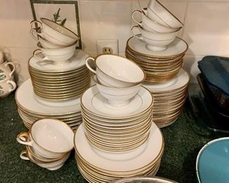 A mixed lot of gold and white china, sold as a lot.