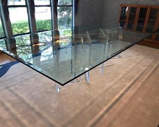 John Mascheroni glass table top with lucite base $8000. 29H x 60W x 120L.  3 pedestals. 