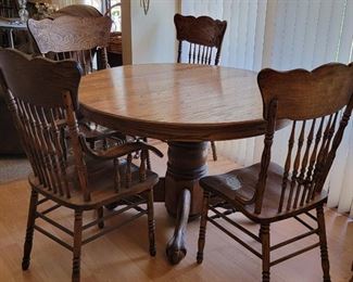 #28. $175.00 oak dining table with 4 chairs 2 arm chairs 