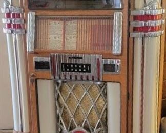 1. $4,000.00.  American Apparatus CD jukebox.  RB 8.  Load max of 200 cd's.  Reproduction.  It's a bubbler!!