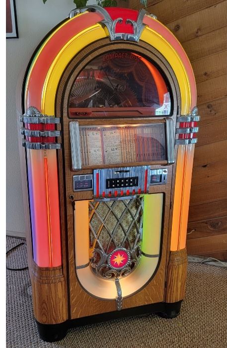1. $4,000.00.  American Apparatus CD jukebox.  RB 8.  Load max of 200 cd's.  Reproduction.  It's a bubbler!!