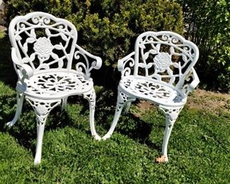 Heavy cast iron white chairs with rose motif