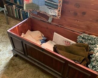 old cedar chest filled with vintage linens