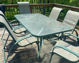 Outdoor Metal and Glass with Insert for Umbrella Table 27 1/2"H x 72 1'4"L x 39 1/2D                                 Chairs  (6) 43"H x 26 1/4"L x 31"D                                         Price $240.00