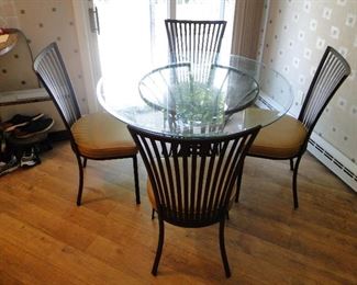 Round Glass Top Table with 4 chairs (vinyl seats) Iron base and chairs $250, 48x30