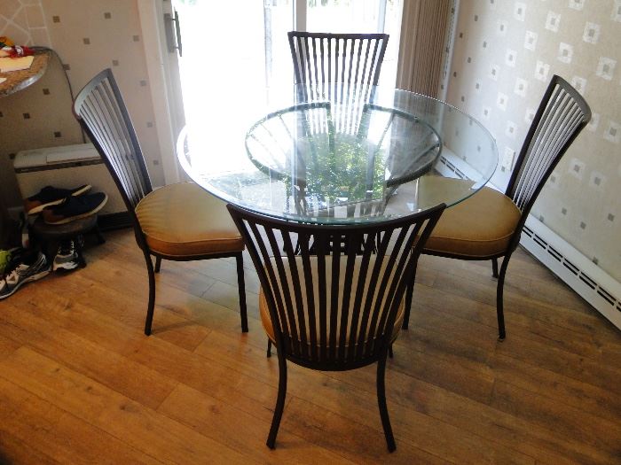 Round Glass Top Table with 4 chairs (vinyl seats) Iron base and chairs $250, 48x30