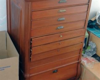 Cabinet has secret compartment in the back