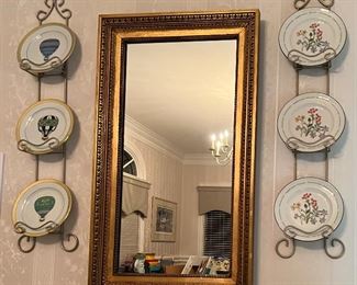 Wall mirror; decorative plates in plate racks