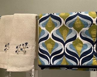 Embroidered hand towels; table runners of different colors and designs