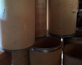 Large, sturdy cardboard barrels...think of all the useful storage