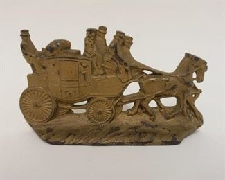 1007 CAST IRON DOORSTOP ENGLISH COACH SCENE, MARKED ON REVERSE WH HOWELL CO, APPROXIMATELY 7 IN X 4 IN HIGH