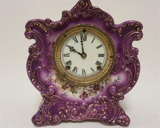 1083 ANSONIA ROYAL BONN LAVENDAR CHINA CLOCK *WINER* APPROXIMATELY 5 1/2 IN X 9 IN X 11 1/4 IN HIGH