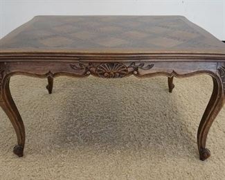 1113 COUNTRY FRENCH PARQUETRY TOP DINING TABLE W/PULL OUR SIDE LEAVES, CARVED SKIRT & LEGS, SOME VENEER REPAIRS ON TOP SURFACE, APPROXIMATELY 51 1/4 IN CLOSED, 90 IN OPEN X 39 1/4 IN X 30 IN HIGH