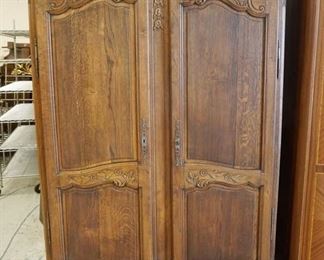 1115 COUNTRY FRENCH CARVED OAK WARDROBE, DOUBLE DOOR W/ADJUSTABLE INTERIOR SHELVING, APPROXIMATELY 56 IN X 22 IN X 80 IN HIGH
