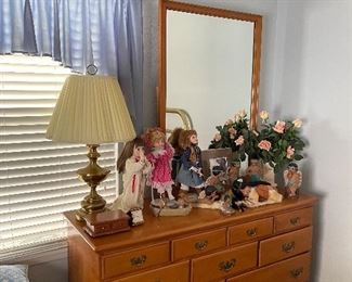 Triple dresser with mirror, dolls, collectables