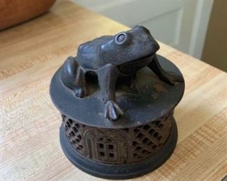 MECHANICAL BANK - Cast Iron Mechanical Frog Bank, manufactured by J & E Stevens, Cromwell, CT, patented 1872, with lattice decorated round base with 'Bank' doors, depressing the frog's right foot opens the mouth, 4 1/2" high, 4 3/8" diameter.