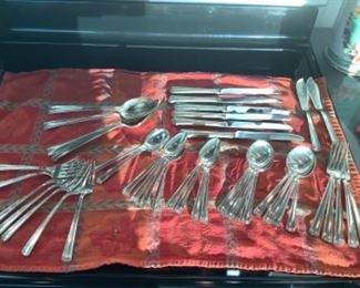 Freshly polished and ready to go! John & Priscilla by Westmoreland Sterling. 6 knives, 5 dinner forks, 7 salad/dessert forks, 8 soup spoons, 8 dinner spoons, 4 serving spoons, 2 butter knives, 2 other spoons