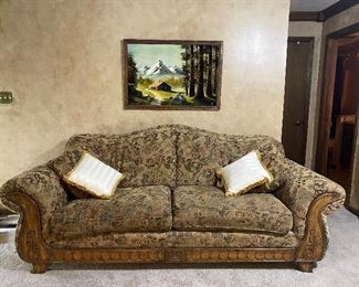 This is a well-made couch with a tapestry type upholstery.  It is very comfortable.  Includes two matching throw pillows.  The white/gold pillows are handmade and are $10 each.   Asking $150.