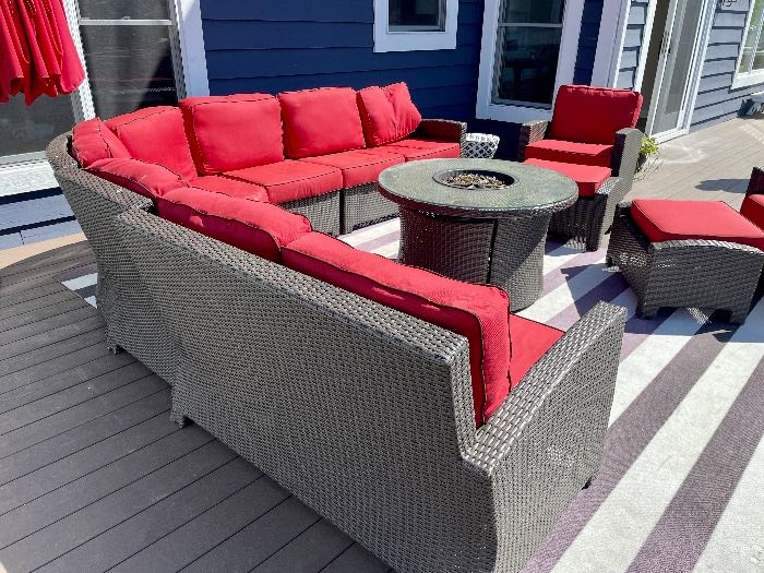 Resin patio sat with cushions, umbrella, chairs and fire pit.