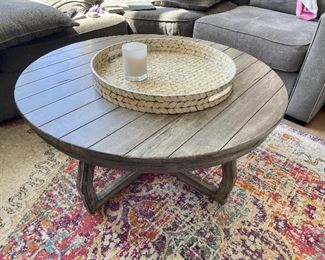 Coffee table, rug. candles, round tray