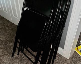 Set of black folding chairs