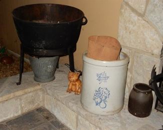 Cast iron kettle on stand, more crocks