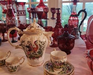 Antique porcelain tea pot and cups and saucers