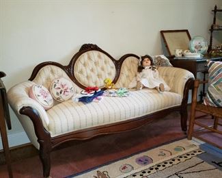 Antique Victorian settee with an antique doll