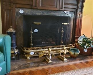 Antique brass fireplace accessories including firetools