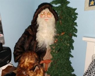 Santa with a fox stands  5 ft