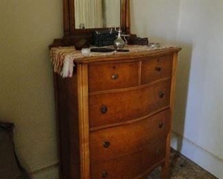 Dresser with swing mirror