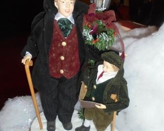 Cratchit & Tiny Tim caroling